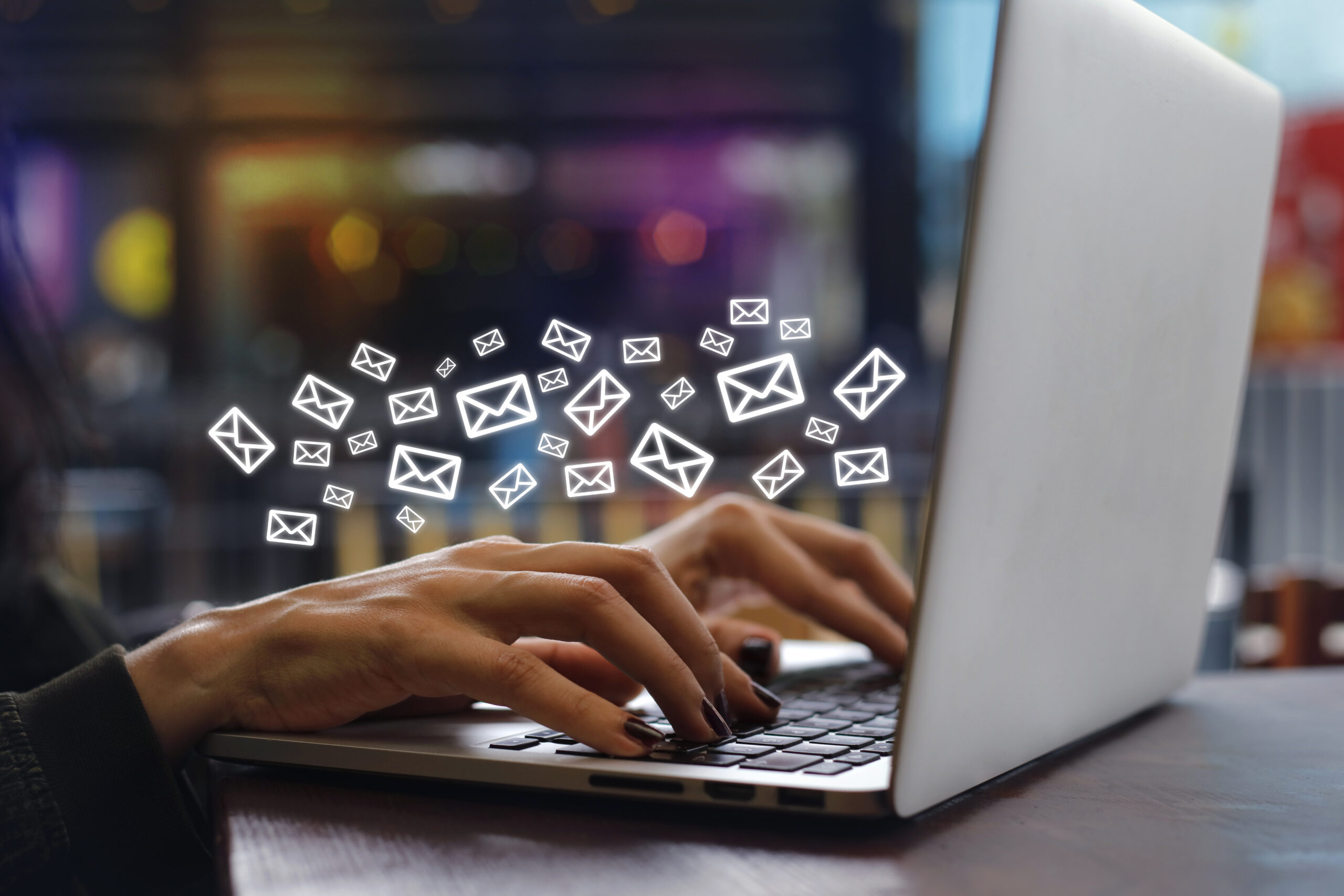 Person typing on a laptop, symbolizing the work of a digital marketing expert